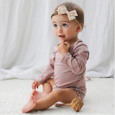 Magnolia long sleeve body suit